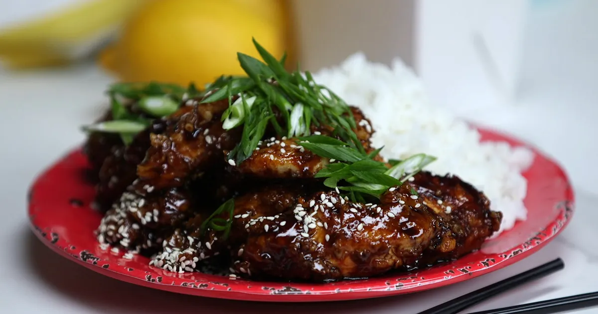 Glazed chicken with steamed rice and spring onions