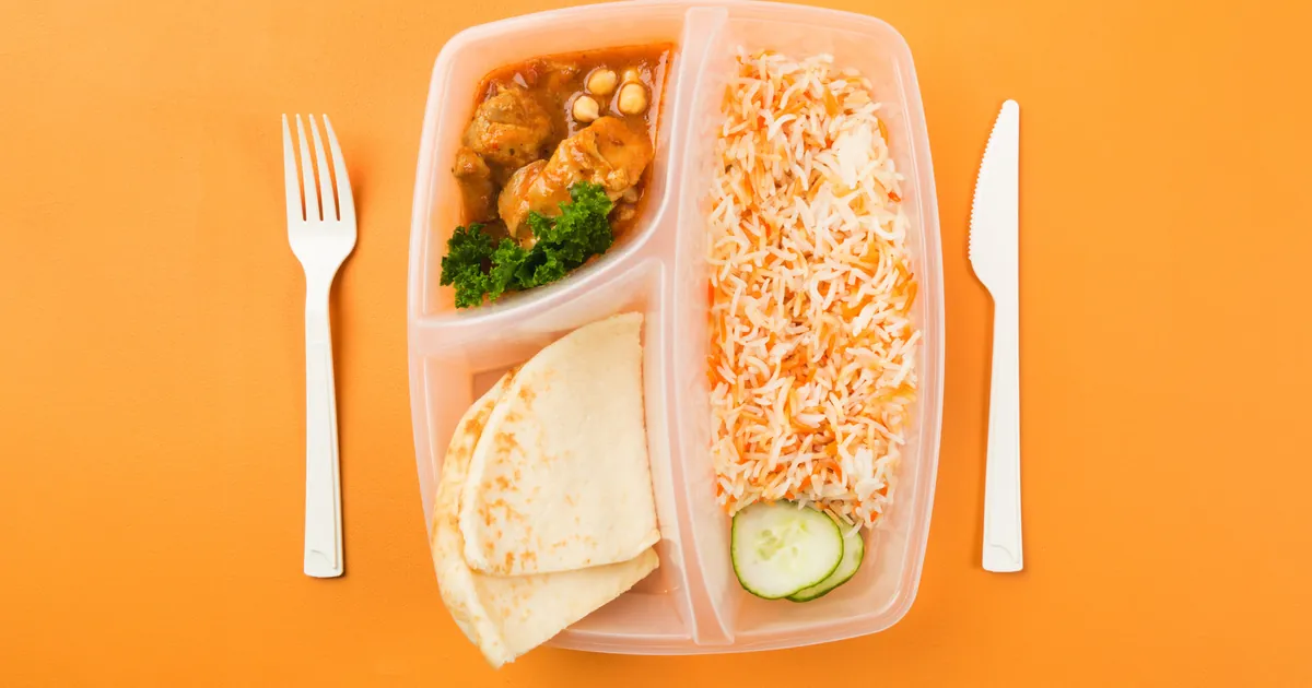 Packed lunch box with chicken, rice and vegetables