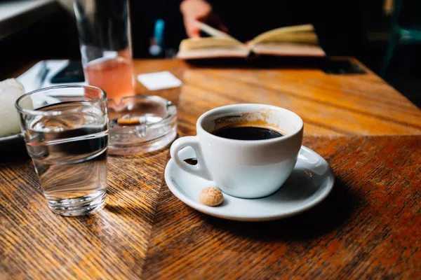 A cup of black coffee on a table