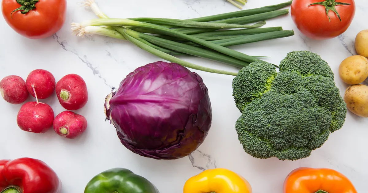 Fresh colourful vegetables laid out on a table