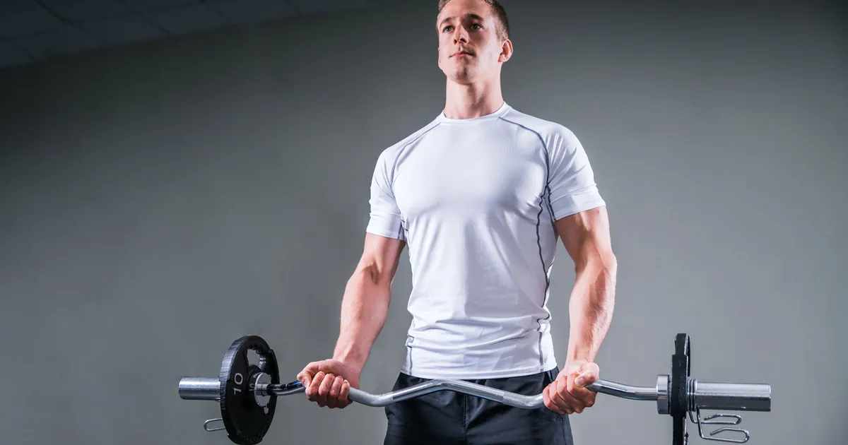 Man lifting a barbell in the gym
