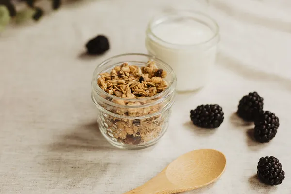Yoghurt and granola breakfast pots with blackberries