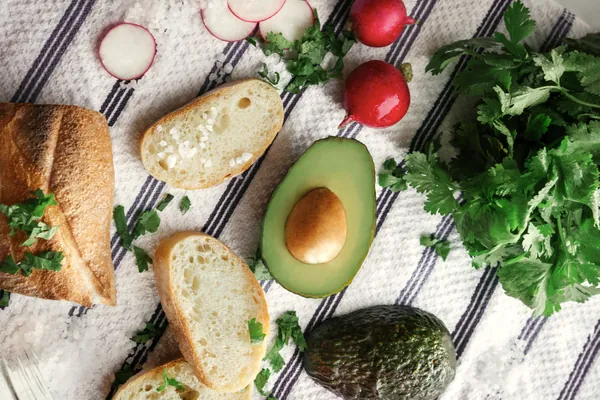 Avocado, bread and ingredients for avocado toast