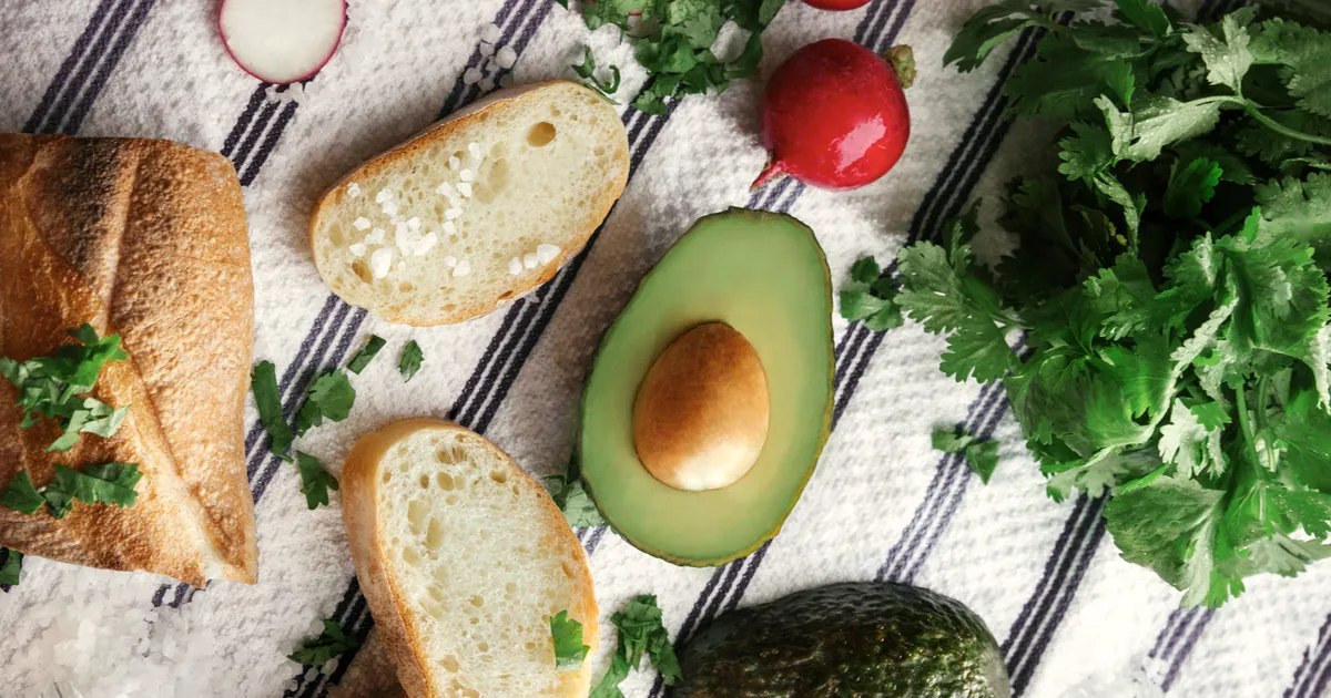Avocado, bread and ingredients for avocado toast
