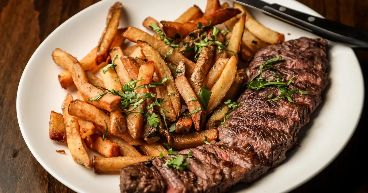 Plate of grilled steak and fries